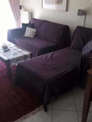 Corner sofa bed used, grey with storage space in the backrest