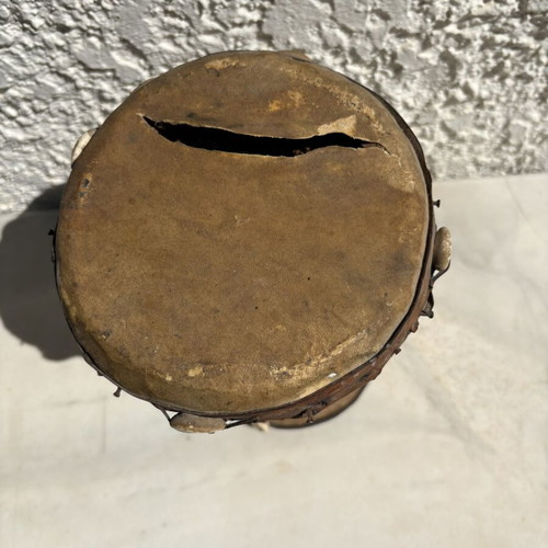 Handmade wooden drum used, African style with leather membrane and shells