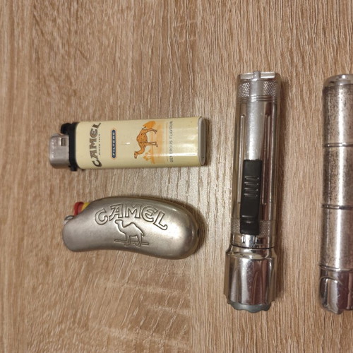 Collection of 25 used vintage lighters and 3 matchboxes from hotels and restaurants