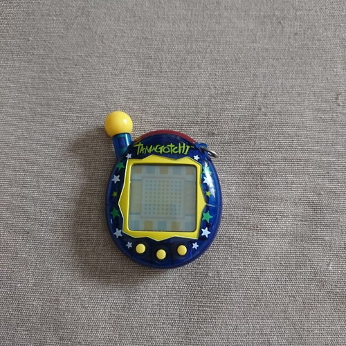 Bandai Tamagotchi Connection V4 used with star pattern blue case