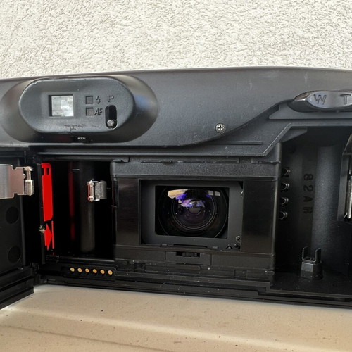 Olympus Super Zoom and Nikon Zoom Touch 600 cameras used