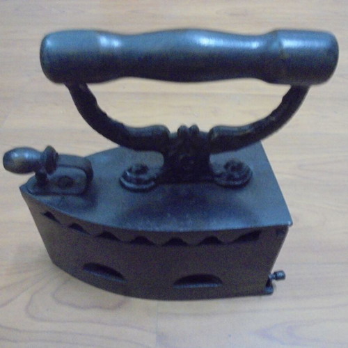 Antique charcoal iron restored with internal grill