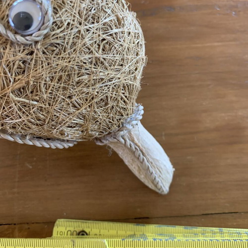 Handmade decorative dolphin made of grass