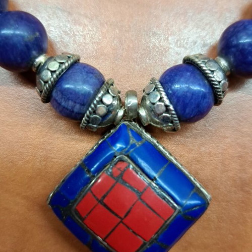Necklace with blue semi-precious stones and silver setting like new