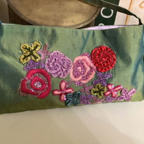 Evening bag satin texture with embossed embroidery like new, multicolor green