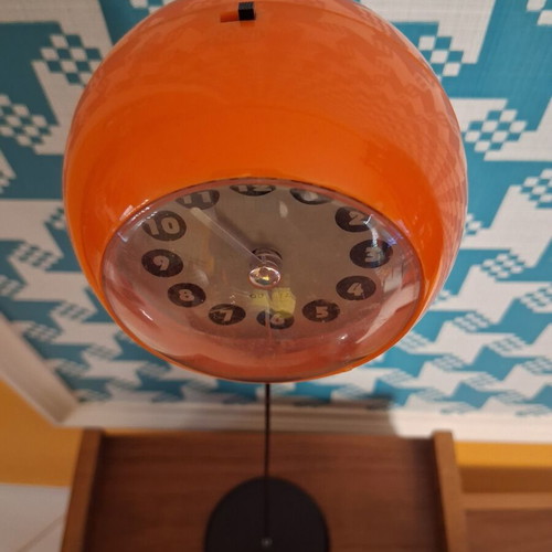 Quartz space age table clock 1970s, orange with black base