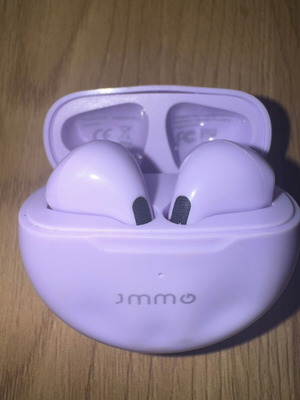JMMO Bluetooth earbuds used with charging case