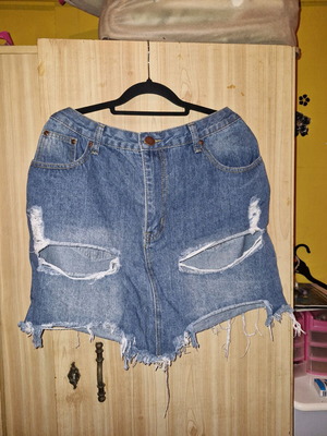 Pretty Little Thing blue denim skirt used, short with rips size 44