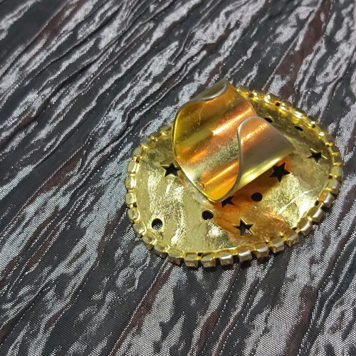 Large ring used, gold color with small strass