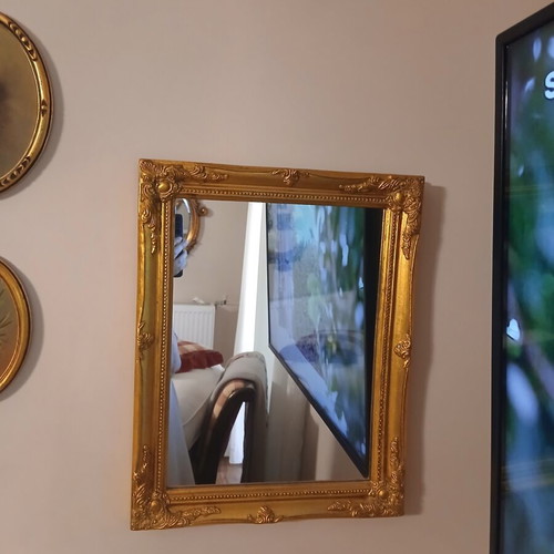 Wooden mirror with golden patina