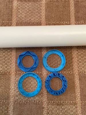 Tupperware rolling pin new with cutters for dough