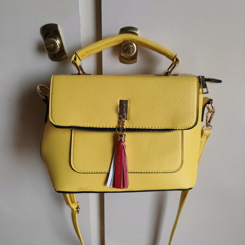 Yellow crossbody bag used with detachable strap