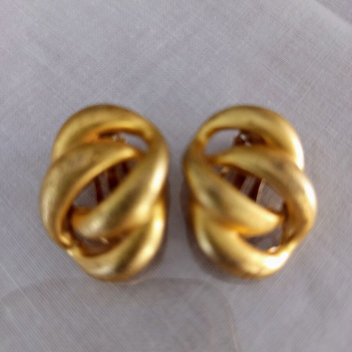 Clip-on earrings used, relief design, bronze tone