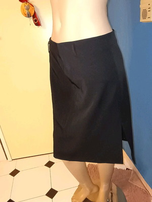 Black skirt used, size M, good condition with tears