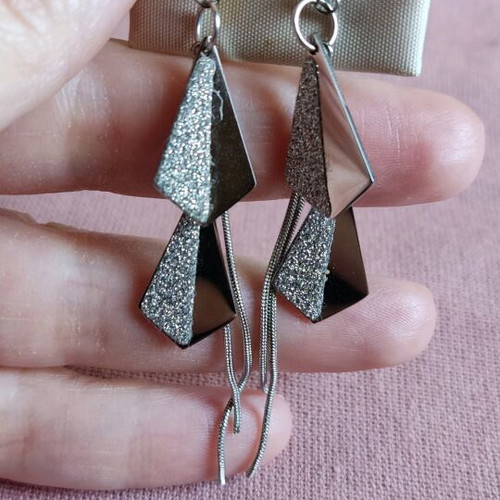 Steel earrings new in silver color