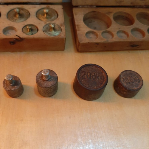 Wooden boxes with used bronze and cast iron scales set