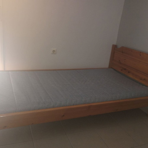Single wooden bed with slats and IKEA mattress 200x90x10