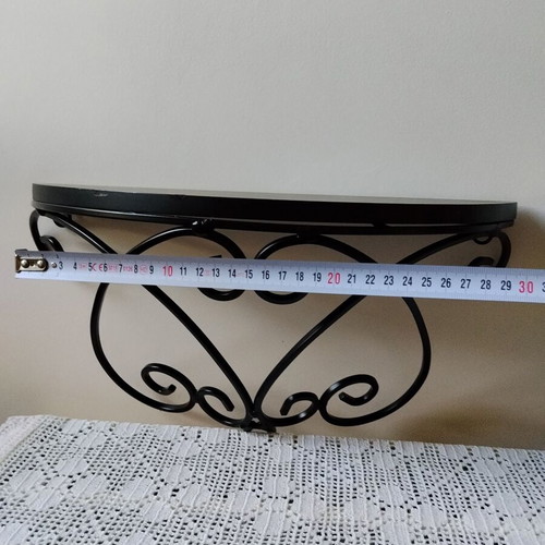 Wall shelf with black metal frame and wooden top, like new