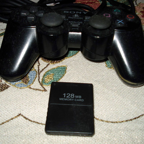 Sony PlayStation 2 Slim SCPH-70004 console bundle with controller and games