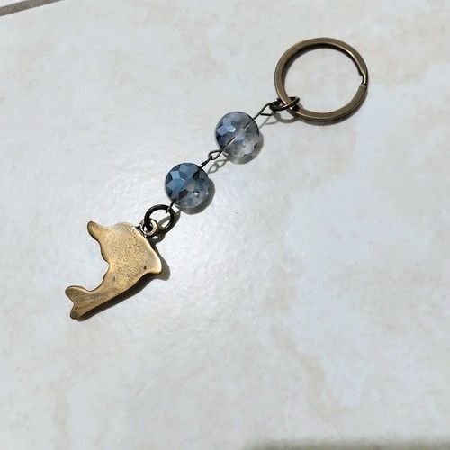 Keychain with dolphin keyholder, like new, gold and blue