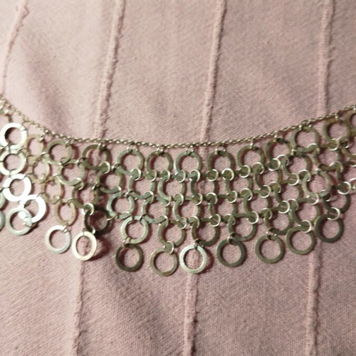Necklace with multiple rows of interconnected silver rings like new