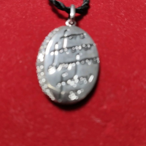 Galerie Tsangarakis silver pendant like new with white sapphires