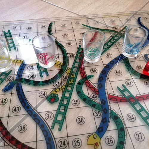 Glass Snakes & Ladders board game used with shot glasses
