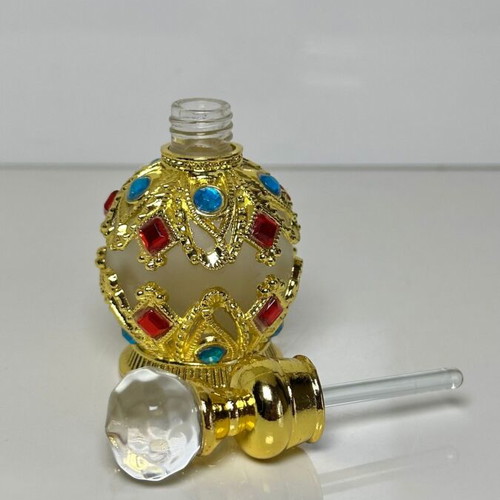 Vintage Arabic perfume bottle with gold metal frame and stones