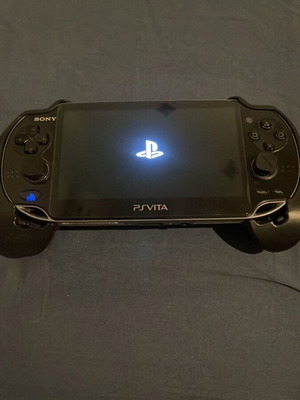 PlayStation Vita като нов с дръжка, 233 игри, 256GB SD карта и hen софтуер