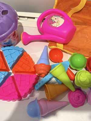 Beach toys set with buckets, watering can, cake, and ice cream