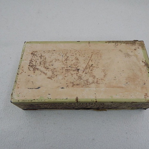 Old metal box used with paper label from England