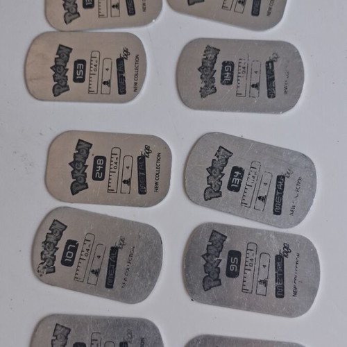 Pokemon metal tags used, set of 10 from 2006