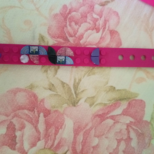Bracelet making set used with beads and tools, includes Lego bracelet