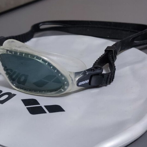 Swimming cap and goggles used in good condition