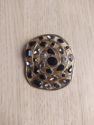 Gold brooch with stones, new condition