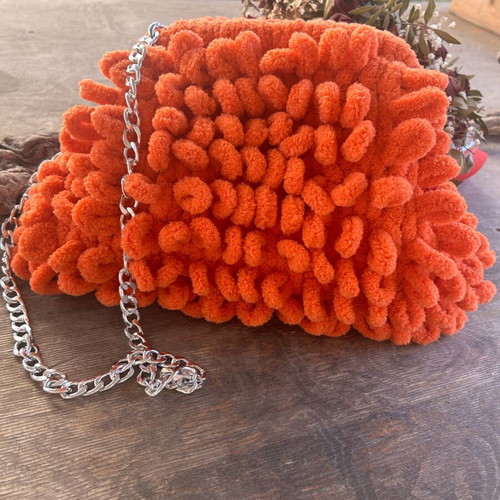 Puffy orange handbag new with lining and chain