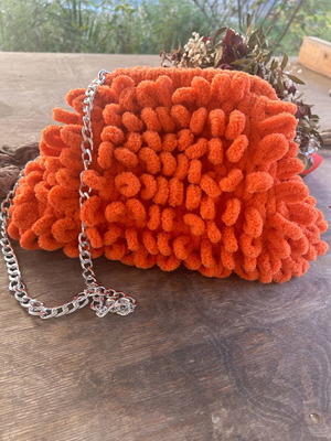 Puffy orange handbag new with lining and chain