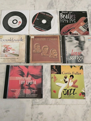 Various CDs like new classical music, love song, jazz, opera
