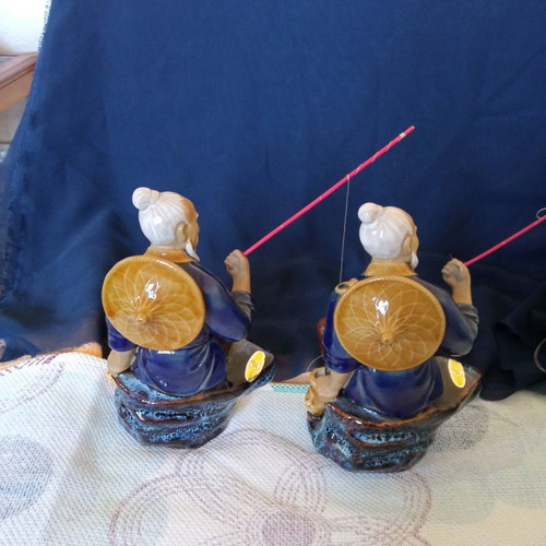 Decorative porcelain figurines used, two Chinese fishermen