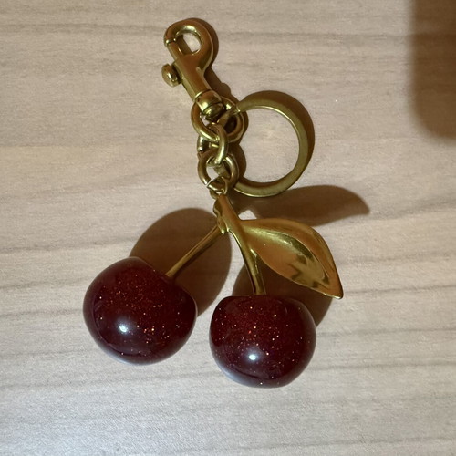 Cherry bag accessory or keychain new, red and gold