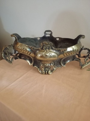 Antique used bronze decorative item with carving
