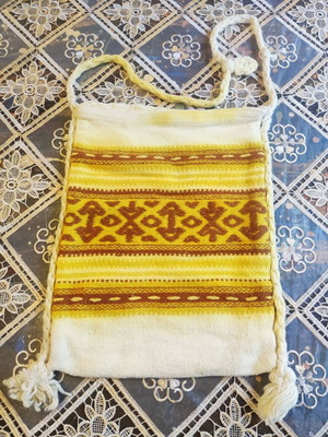 Vintage handmade woolen bag with traditional geometric patterns used