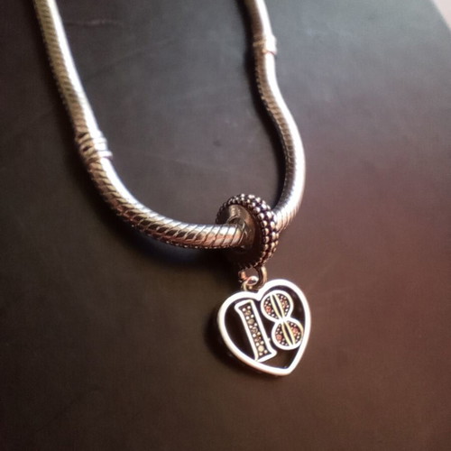 Pandora charm 18 years old, like new, silver