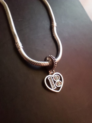 Pandora charm 18 years old, like new, silver