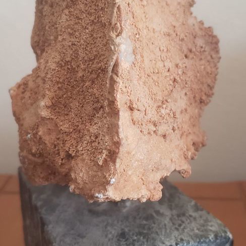 Natural raw mountain crystal used on large marble base