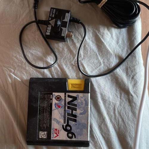Sega Mega Drive NHL 96 game and RF tuner pack
