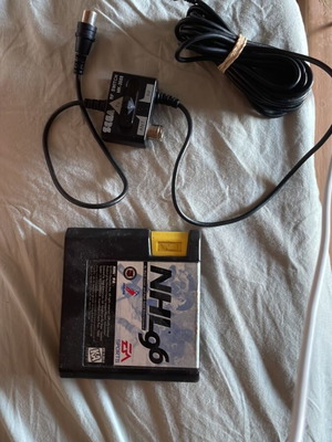 Sega Mega Drive NHL 96 game and RF tuner pack