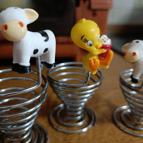 Set of 3 used egg holders with children characters, stainless steel