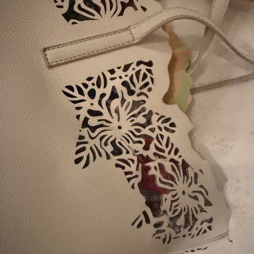 Caprisa shoulder bag used with floral inner pouch, white