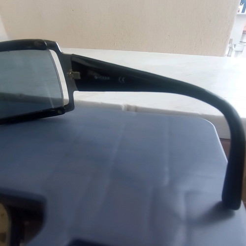 Vogue sunglasses used, black with scratch on lens